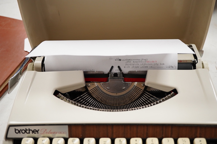 A 1970’s Brother Deluxe 900 working portable typewriter, 30cm x 30cm